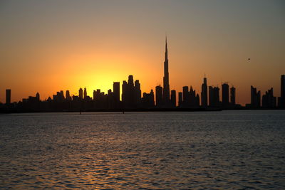 Dubai slyline from dubai creek harbour and dubai canal to downtown and business bay, uae