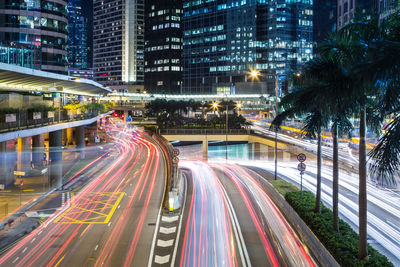 High angle view of light trails on road at night