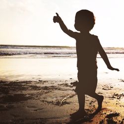 Man playing in sea at beach