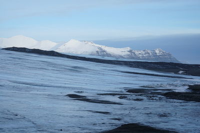 Scenic view of frozen lake against sky