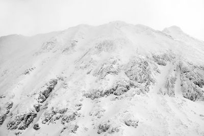 Scenic view of snow covered mountain against sky