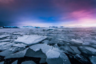 Scenic view of frozen lake against sky