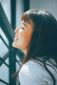 Portrait of young woman looking away