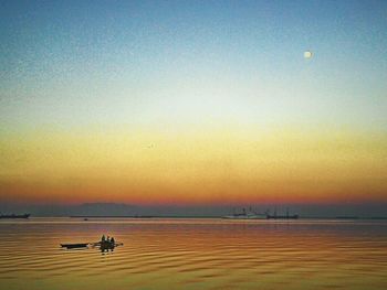 Scenic view of sea at sunset