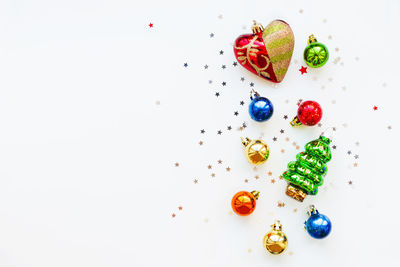 Christmas decorations. new year symbols. colorful balls, heart and confetti. copy space.