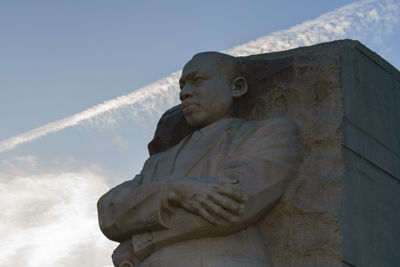 Low angle view of statue against sky