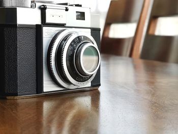 Close-up of camera on table