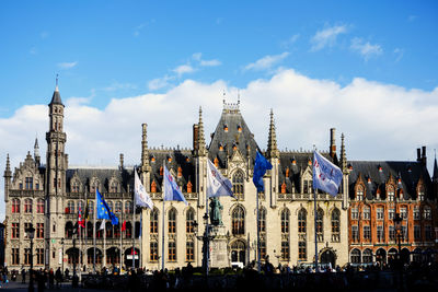 Panoramic view of buildings in city against sky