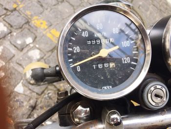 Close-up of tachometer of stationary motorbike