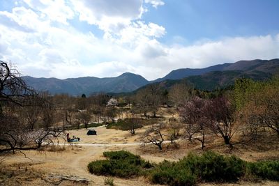 Scenic view of landscape and mountains against sky