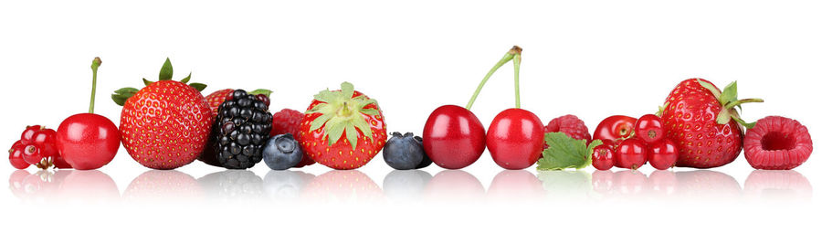 Close-up of multi colored candies against white background