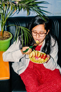 Portrait of young woman eating food. women need quality food for diet.