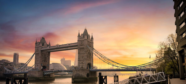 View of bridge over river against cloudy sky