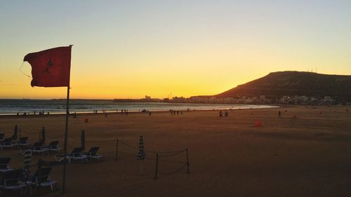 Scenic view of beach against clear sky