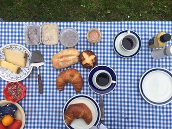 Directly above shot of breakfast on table at garden