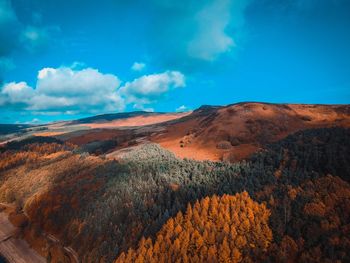 Scenic view of landscape against blue sky