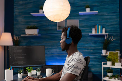 Side view of businessman working at office