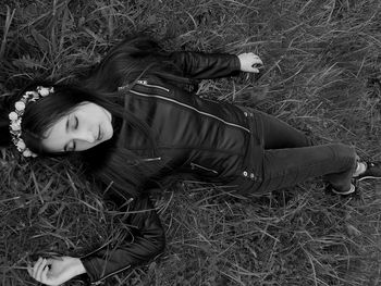 High angle view of woman lying on grass