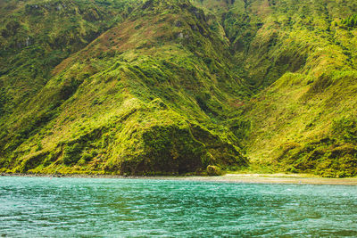 Scenic view of sea against mountain