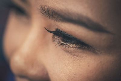 Close-up of woman eye looking away