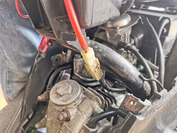 Midsection of man repairing car