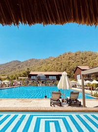 Lounge chairs in swimming pool