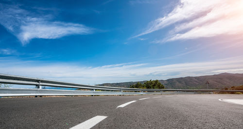 Mediterranean sea coast road into mountains horizon in summer with beautiful bright sun rays 