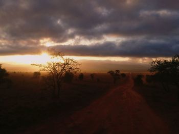 Scenic view of landscape against sky at sunset