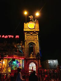 Low angle view of illuminated building at night