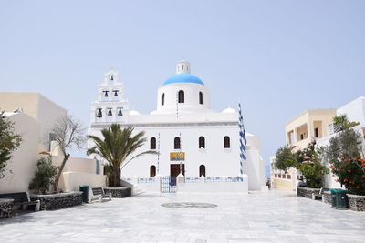 Exterior of buildings against clear blue sky