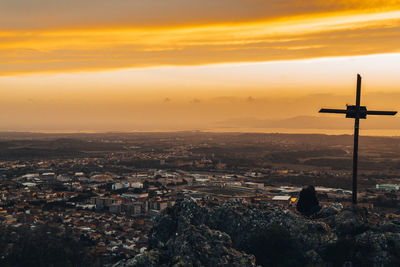 Cityscape against sky during sunset