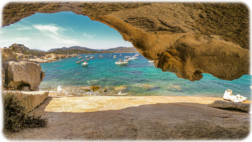 Scenic view of sea shore against sky