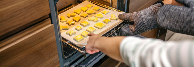 Cropped hand of person holding food