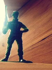 Full length of boy standing in corridor