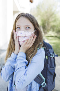 Close-up of woman looking away outdoors