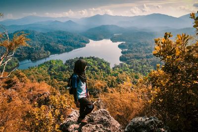 High angle view of woman standing on mountain