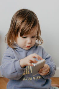 Close-up of girl using mobile phone