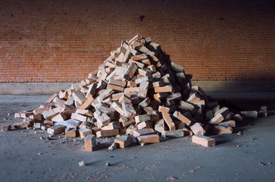 Heap of bricks against wall