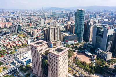 High angle view of buildings in city against sky