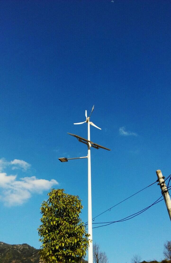 low angle view, blue, wind power, fuel and power generation, wind turbine, alternative energy, clear sky, environmental conservation, windmill, renewable energy, copy space, technology, sky, airplane, transportation, day, outdoors, nature, no people, flying