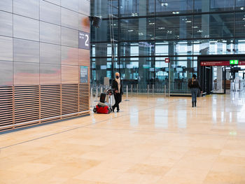 People walking in modern building