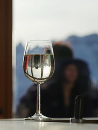 Close-up of wineglass on table at restaurant