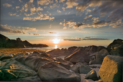 Scenic view of landscape against sky during sunset