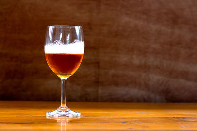 Close-up of beer glass on table