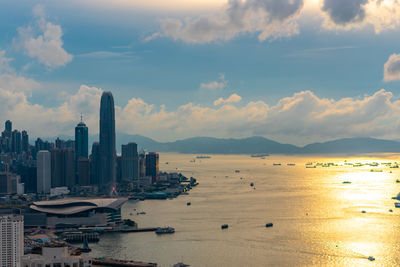 Panoramic view of sea and buildings against sky