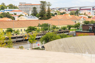 High angle view of buildings by street in city