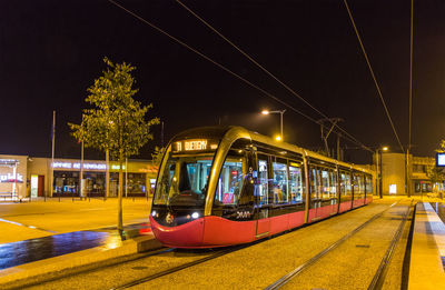 Train on railroad tracks at night