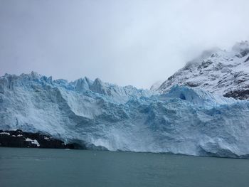 Scenic view of frozen lake against sky