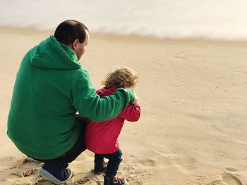 Boy on beach during winter