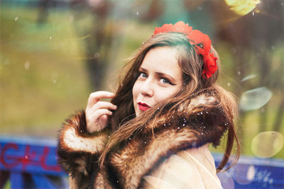 Portrait of young woman in winter